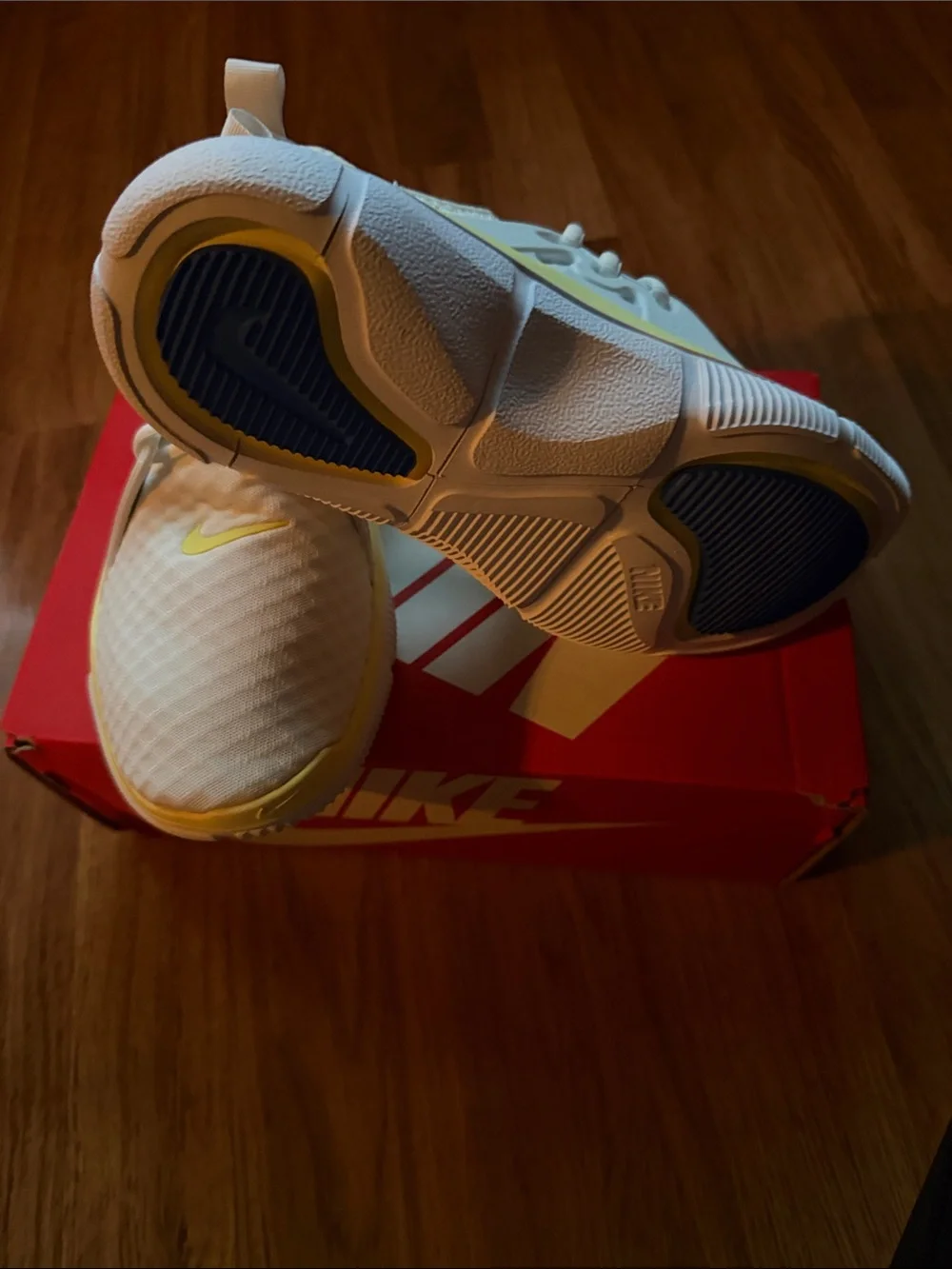Nike White Athletic Sneakers with Blue Swoosh and Cream Trim